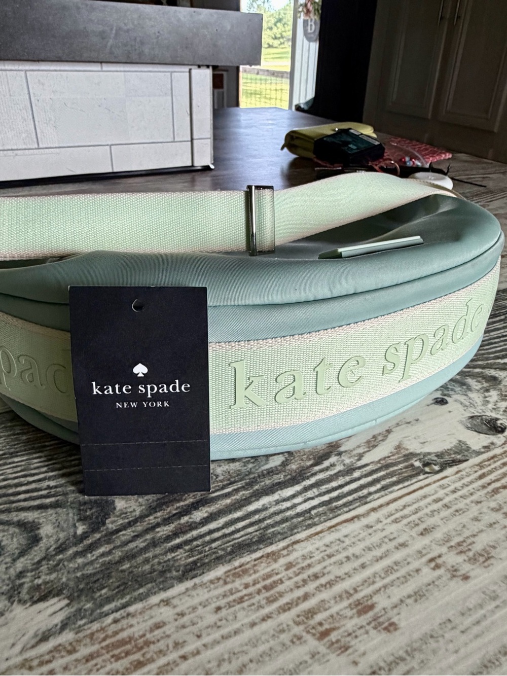 kate spade mint green logo plaque handbag front